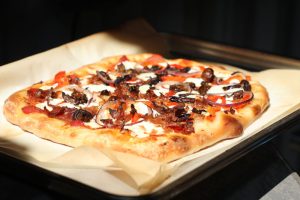 Pizza Slow Cooked on Wood Burning Grill