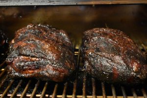 Two Pork Shoulders on a Memphis Grill