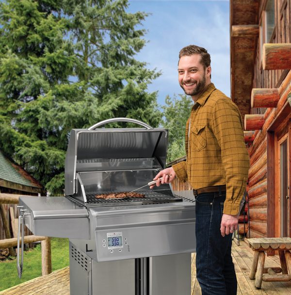 Man grilling on a Beale Street stainless steel pellet grill