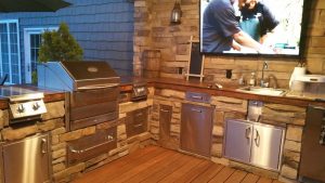 L-Shaped Outdoor Kitchen with TV